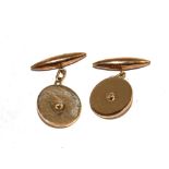 A set of 15 carat gold cufflinks with diamonds to the centre