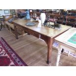 An early 19th century elm farmhouse table, the rectangular top with a drawer to the end frieze and