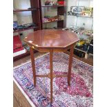An Edwardian mahogany and boxwood octagonal occasional table, the patera inlaid top on square