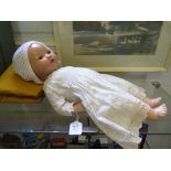 An Armand Marseille baby head doll, 351/4K, with brown closing eyes and two teeth, composite body