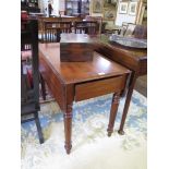 A Victorian mahogany Pembroke table, the top with moulded edge and rounded leaves over a frieze