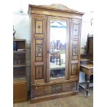 A late Victorian painted mahogany four piece bedroom suite, comprising mirrored door wardrobe,