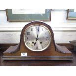 An oak 'Admiral Hat' mantel clock with silvered dial, a Victorian clock movement and dial in a later