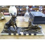 Two German shepherd dogs on a marble plinth c.1930