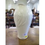 A Belleek vase, with moulded butterfly and reed design 28cm high