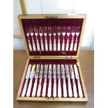 A canteen of tea knives and forks with mother of pearl handles for twelve