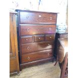 A Stag Minstrel chest of drawers and bedside chest of drawers, and a wood sample inlaid sewing