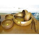 A teak salad bowl, six side bowls and a pair of salad servers