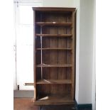 A pine open bookcase, with moulded cornice and plinth base, 75cm wide 169cm high