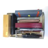 A collection of fountain pens, pencils and other writing implements, including Conway Stewart,