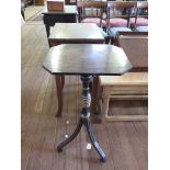 A Regency ebonised and gilded adjustable wine table, the associated mahogany top on a turned