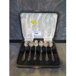 A case of six silver coffee spoons