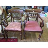 A matched pair of mahogany Willian IV carver dining chairs, each with broad top rails, scroll carved