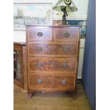 A George III style mahogany and satinwood crossbanded chest of drawers with two short and three long
