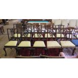 A Harlequin set of ten George III style mahogany dining chairs, all with pierced vase shape splats