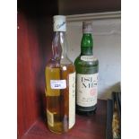 A bottle of 12 year old Cardhu Highland malt Scotch whisky (low level) and another 7 year old