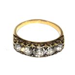 A fine quality five stone diamond ring set in gold colour metal