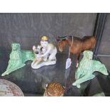 A pair of Sylvac figures of seated dogs, a Russian figure of a boy and dog, and a Beswick horse,