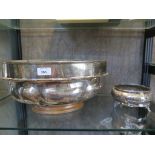 A case set of four plated napkin rings, a silver plated bird, a small tankard, a plated meat cover