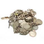 A collection of silver jewellery to include charm bracelet, coin bracelet, etc