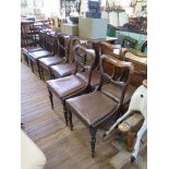 A set of eight early Victorian rosewood dining chairs, the shaped top rails over acanthas carved mid