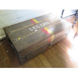 A 1930s Louis Vuitton cabin trunk, named Legard, with red and yellow bands, wooden struts and