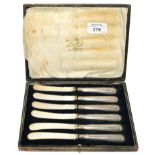 A cased set of tea knives with silver handles