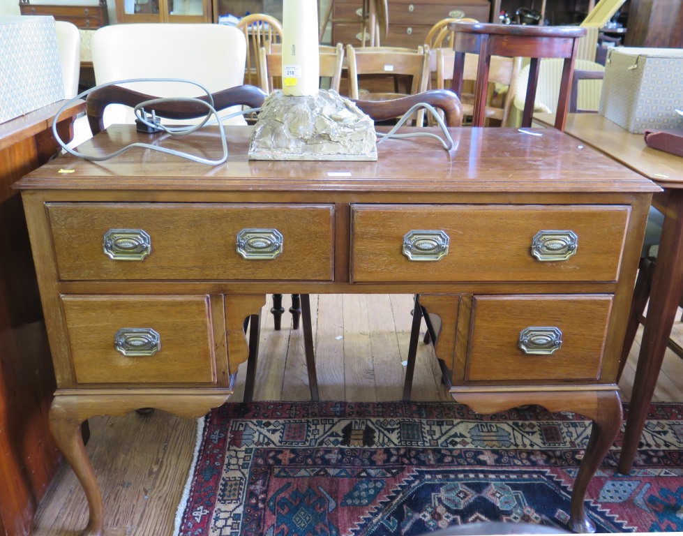 A mahogany lady's writing table, with two drawers over a kneehole flanked by short drawers on