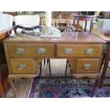 A mahogany lady's writing table, with two drawers over a kneehole flanked by short drawers on