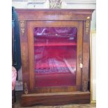 A Victorian inlaid walnut display cabinet, with cavetto moulded frieze, giltmetal mounts and