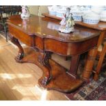 A mid Victorian burr walnut console table, the shaped top with frieze drawer on cabriole supports