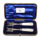 A cased pair of silver pickle forks with mother of pearl handles, Sheffield 1900