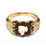 A 14 carat gold ring set with a stone cameo