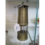 A Protector brass miner's lamp, Prestwich patent, 24cm high