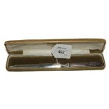 A silver handled paper knife in presentation case, Sheffield 1976