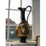 Large pottery ewer shaped jug/vase with raised leaf design