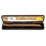 A 15 carat gold bracelet in fitted box by Goldsmiths & Silversmiths Co, Regent Street