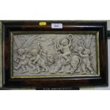 A framed plaque, depicting putti with instruments and a lion, 16 x 31cm