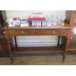 An Edwardian walnut washstand, the rectangular top over two burr walnut frieze drawers on ring