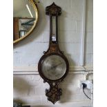 A Victorian rosewood banjo barometer, inlaid in brass and mother of pearl, retailed by W. Ladd & Co.