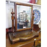 A Victorian mahogany toilet mirror, the rectangular plate on turned supports and platform base, 59cm