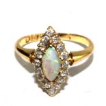 A diamond and opal ring