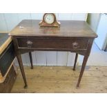 A George II style oak side table, the top with moulded edge over a frieze drawer on turned