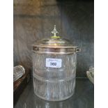 A cut glass bon bon / biscuit barrel with silver plated top