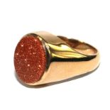 A 9 carat gold ring set with a goldstone