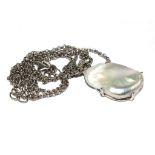 A pendant set with natural pearl