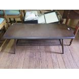 An Ercol dark stain rectangular coffee table with turned undershelf, 105cm wide.