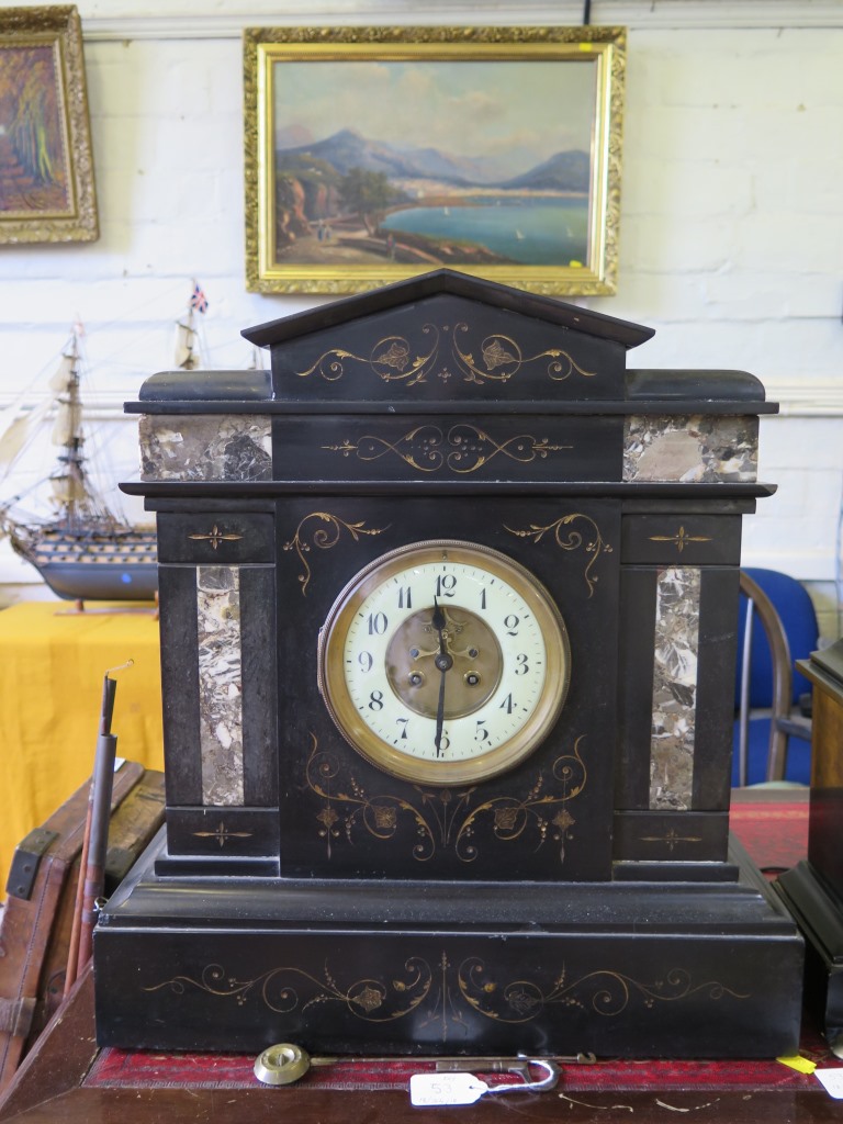 A late Victorian large slate and marble mantel clock, with gilt scroll highlights and exposed