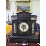 A late Victorian large slate and marble mantel clock, with gilt scroll highlights and exposed