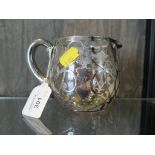 A glass jug richly overlaid with intricate floral sterling silver design, mark on rim by handle